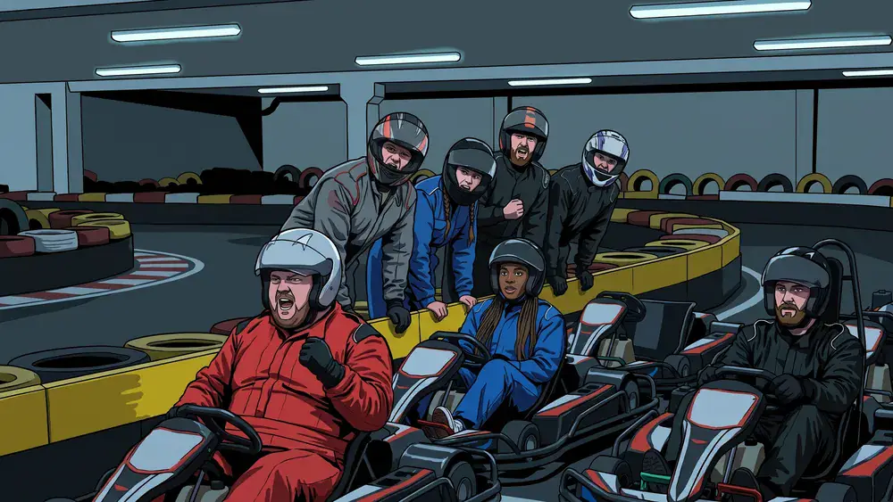 Kartbahn in Hannover - Gruppe feuert vom Bahnrand aus die Fahrer in den Elektro-Karts an